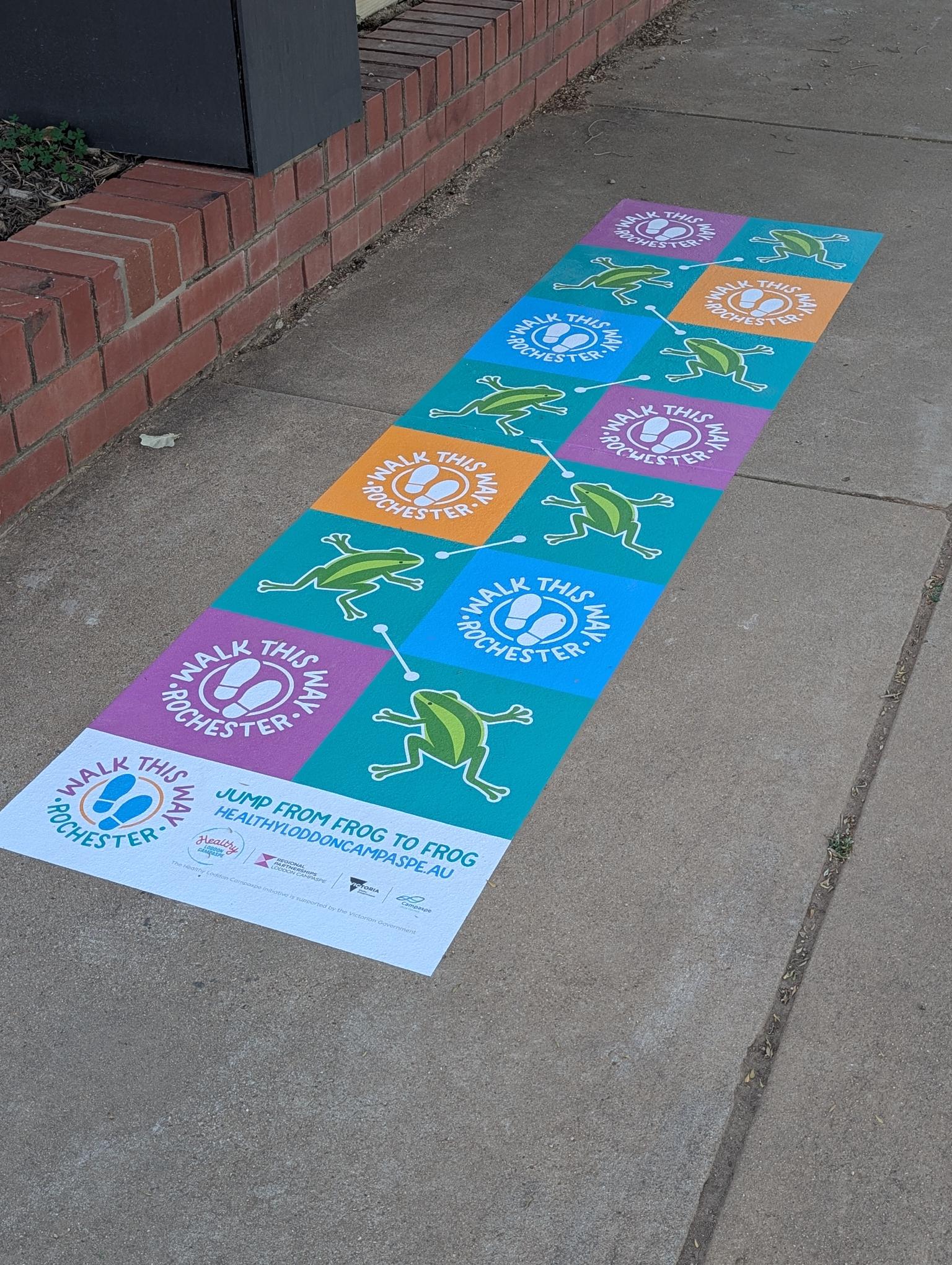 Walk This Way decal on footpath