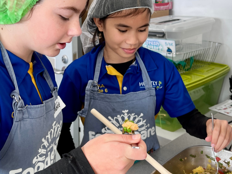 Two students cooking